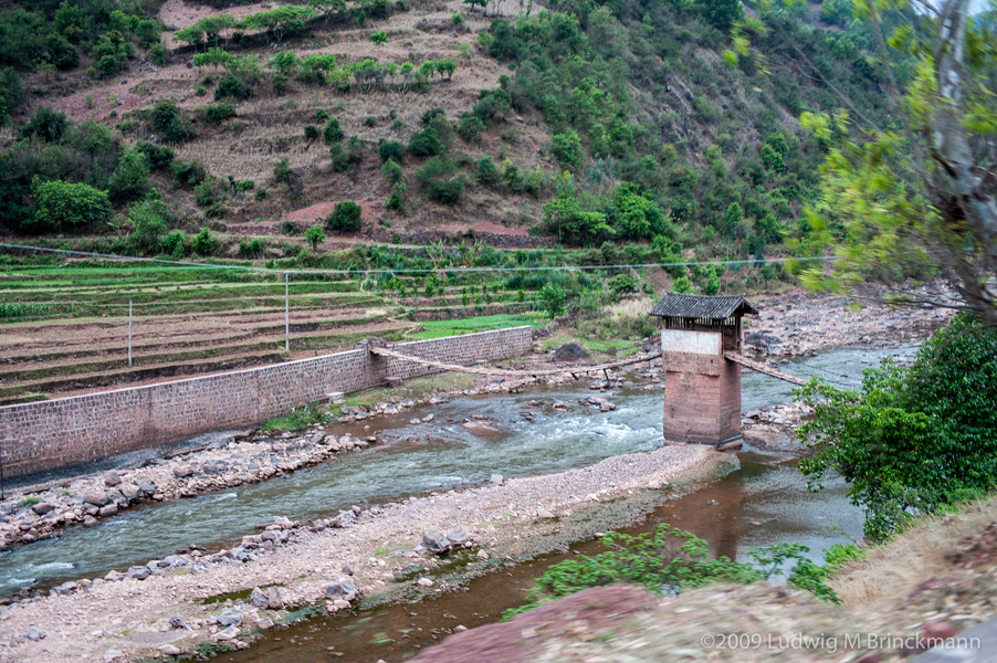 Picture: Two span iron chain bridge with a pier in the middle of the river.&nbsp;