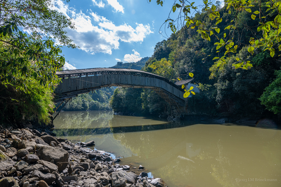 Picture: Minfu Bridge spans the Longjiang River in a remote location.