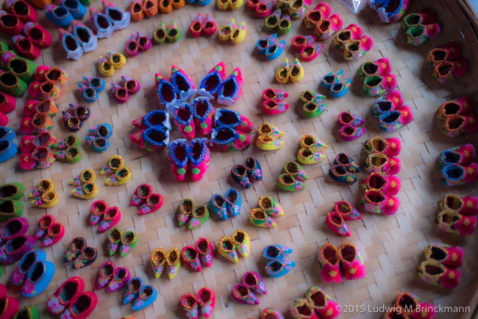Picture: Cloth-made tiny shoes made as souvenirs in Xizhou.