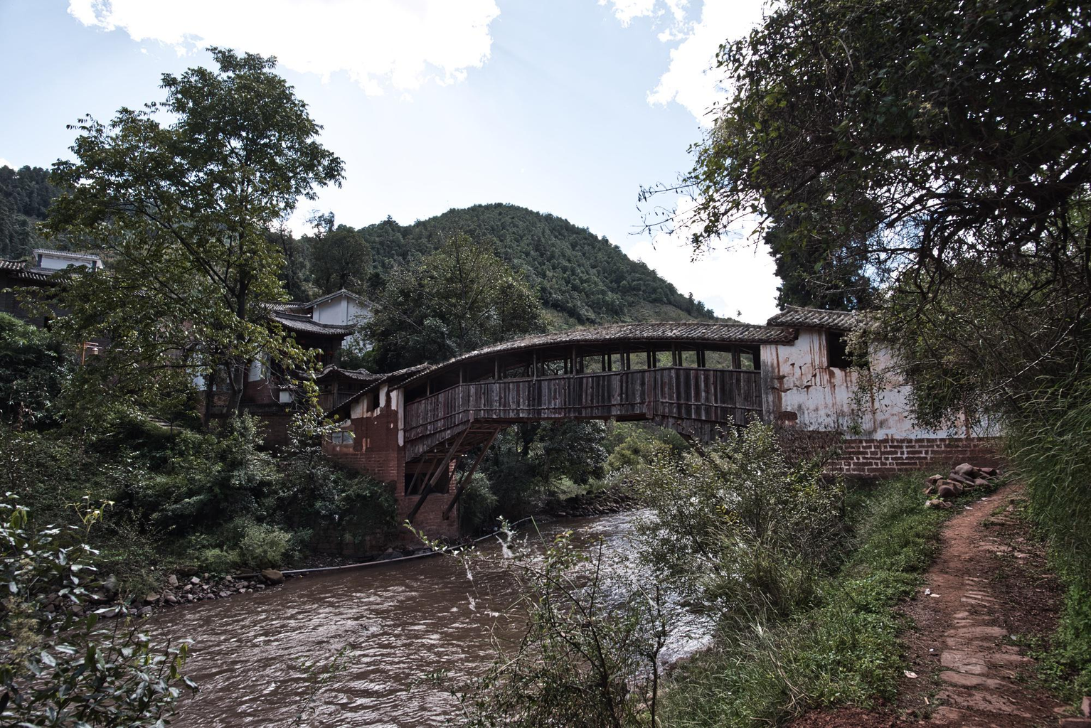 Picture: Traditional style covered wooden bridge in Yunlong county.