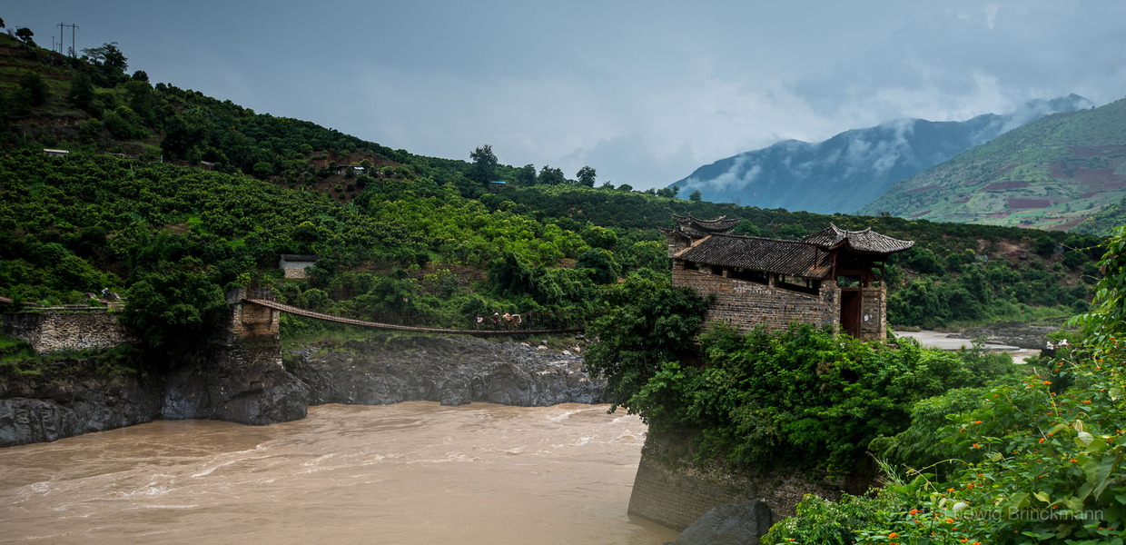 Picture: Yi people crossing one of Yunnan's oldest chain bridges across the Nujiang. 