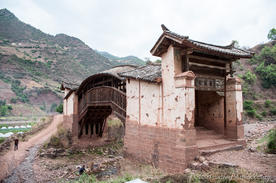 Picture: Covered bridge over a tributary to the Bijiang River.